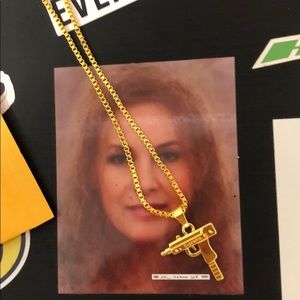 Supreme gold uzi chain link